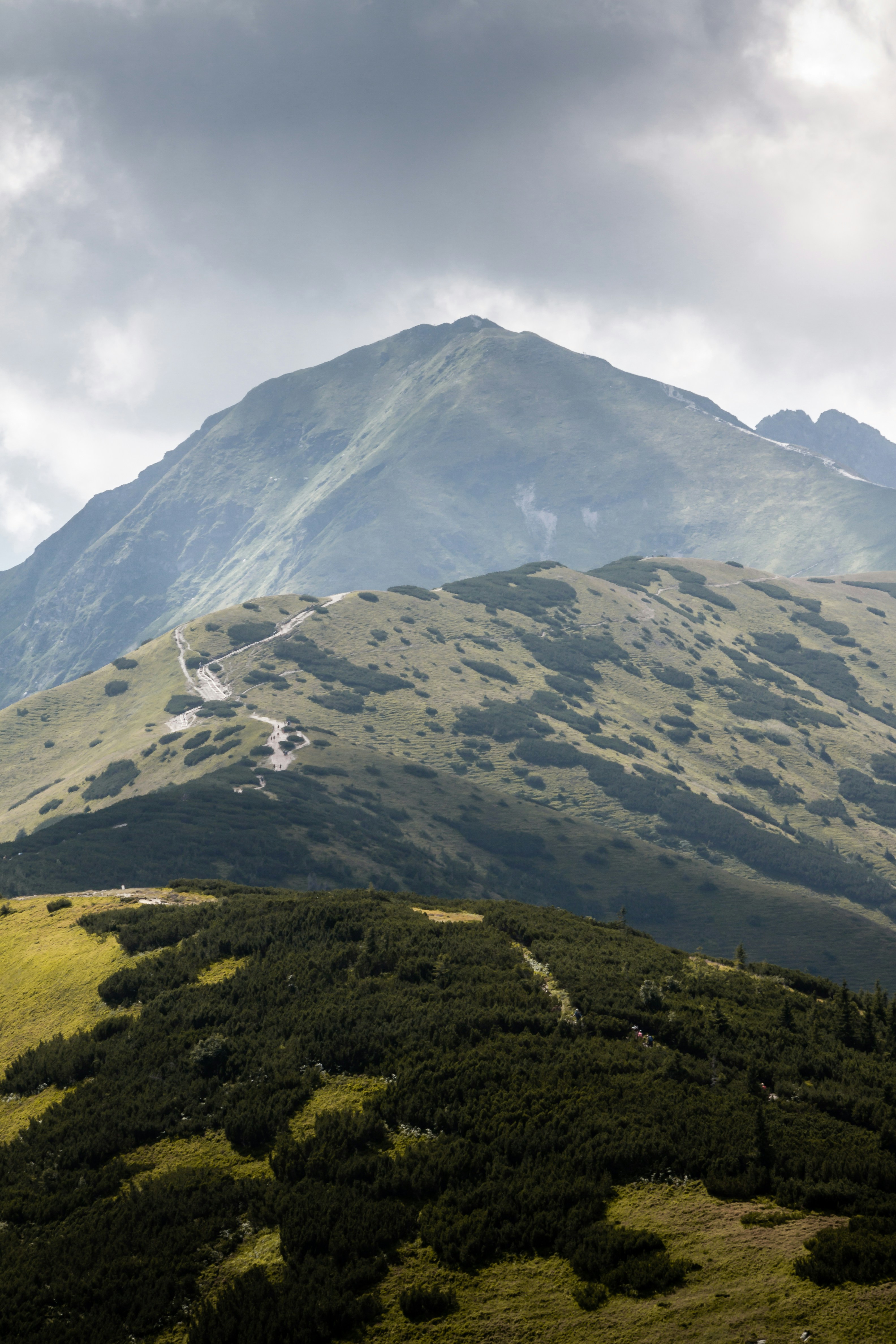 a view of a mountain range with a cloudy sky