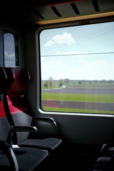 Fields passing a train window