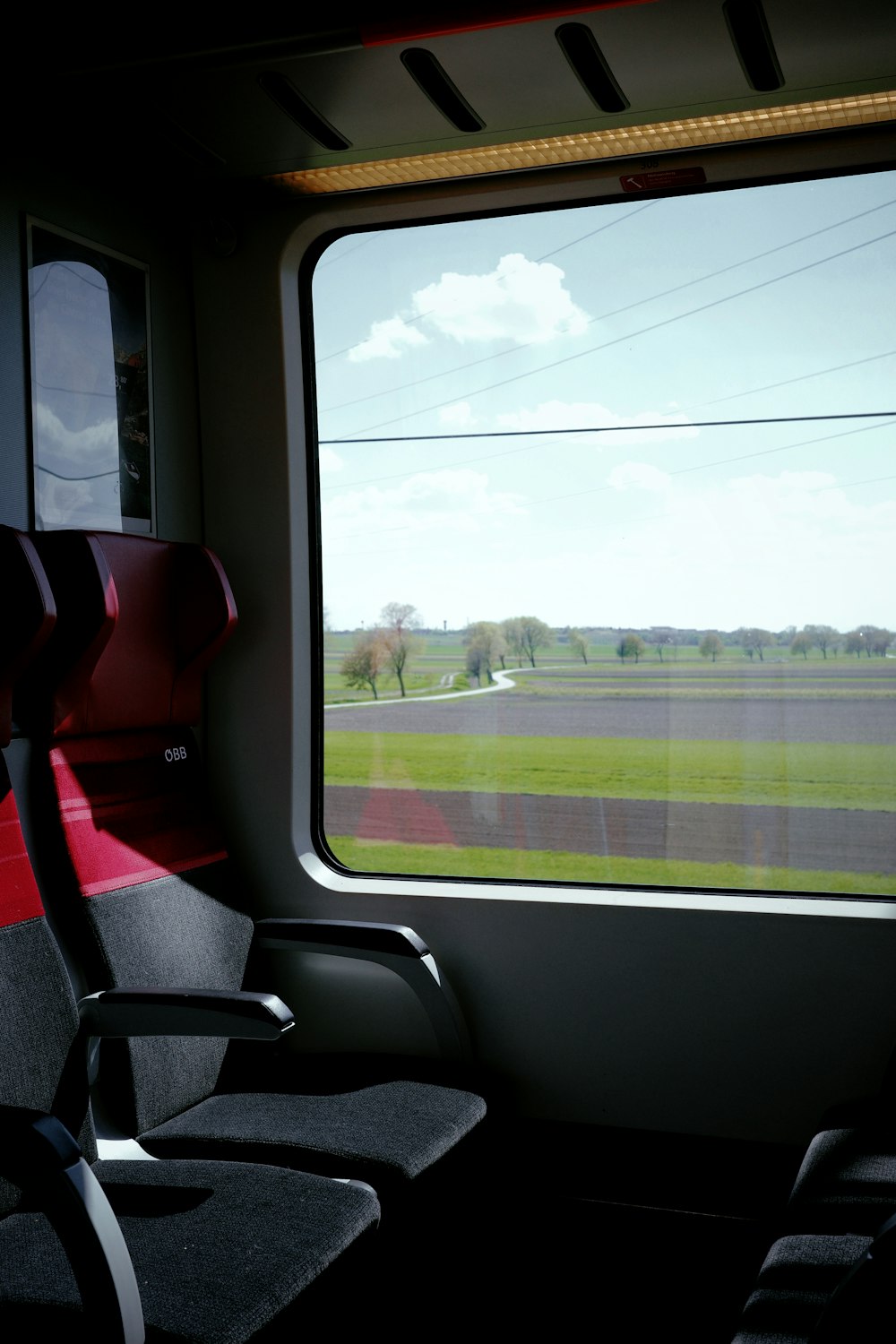 a view of a field through a train window