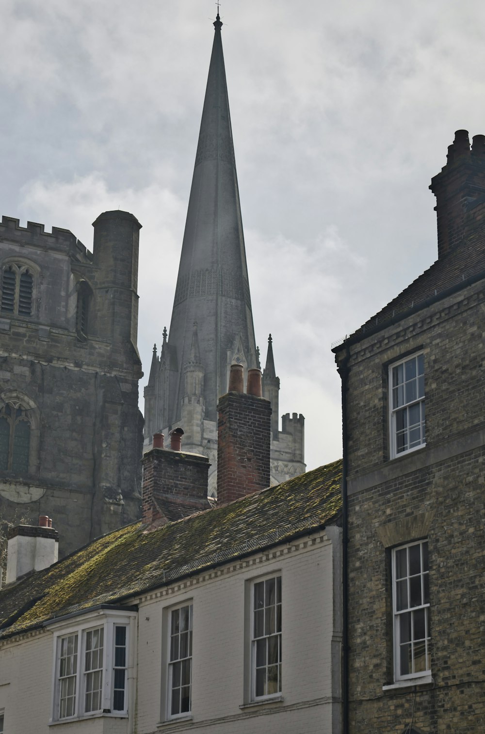 an old building with a steeple in the background