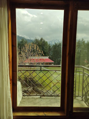 Front view of a cozy ground-level suite surrounded by greenery in Chilliwack.