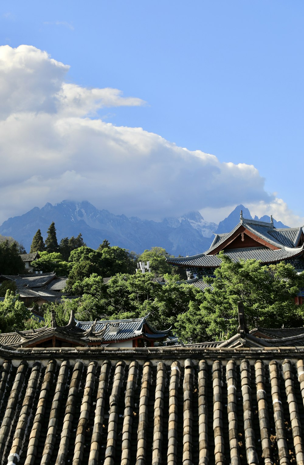 a view of a mountain range from a roof