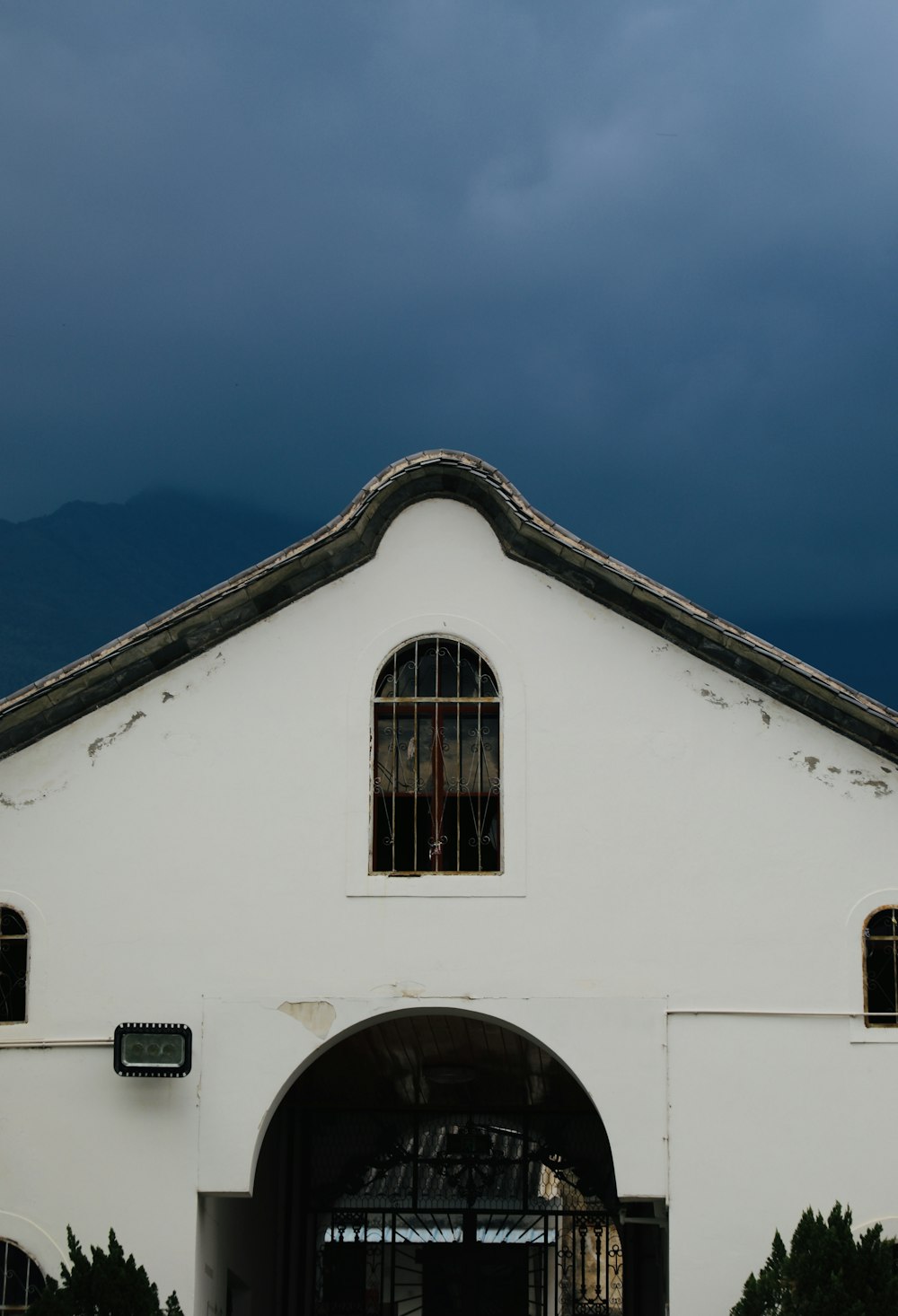 a white building with a clock on the front of it