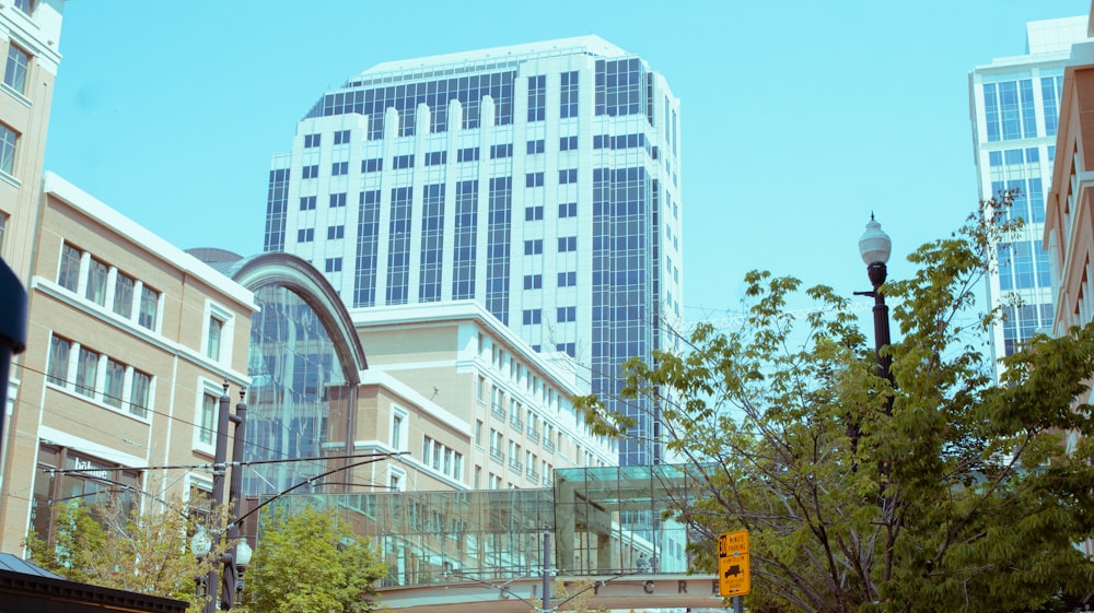 a view of a city street with tall buildings in the background