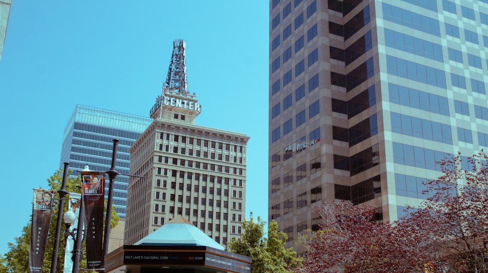 a city street with tall buildings in the background