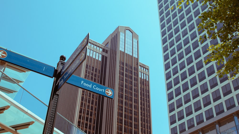 a street sign in front of a tall building