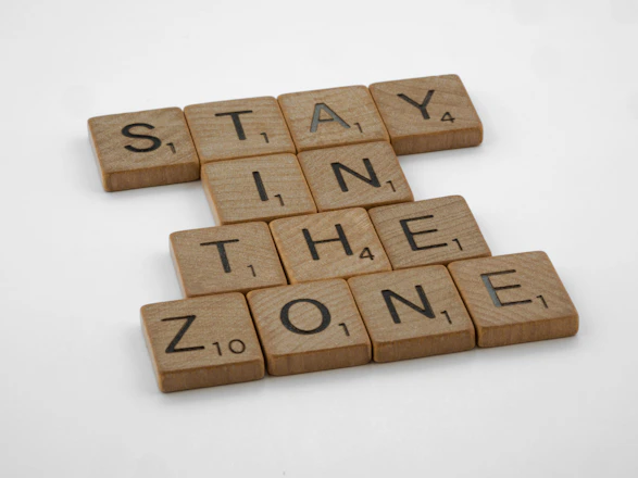 scrabble tiles spelling stay in the zone