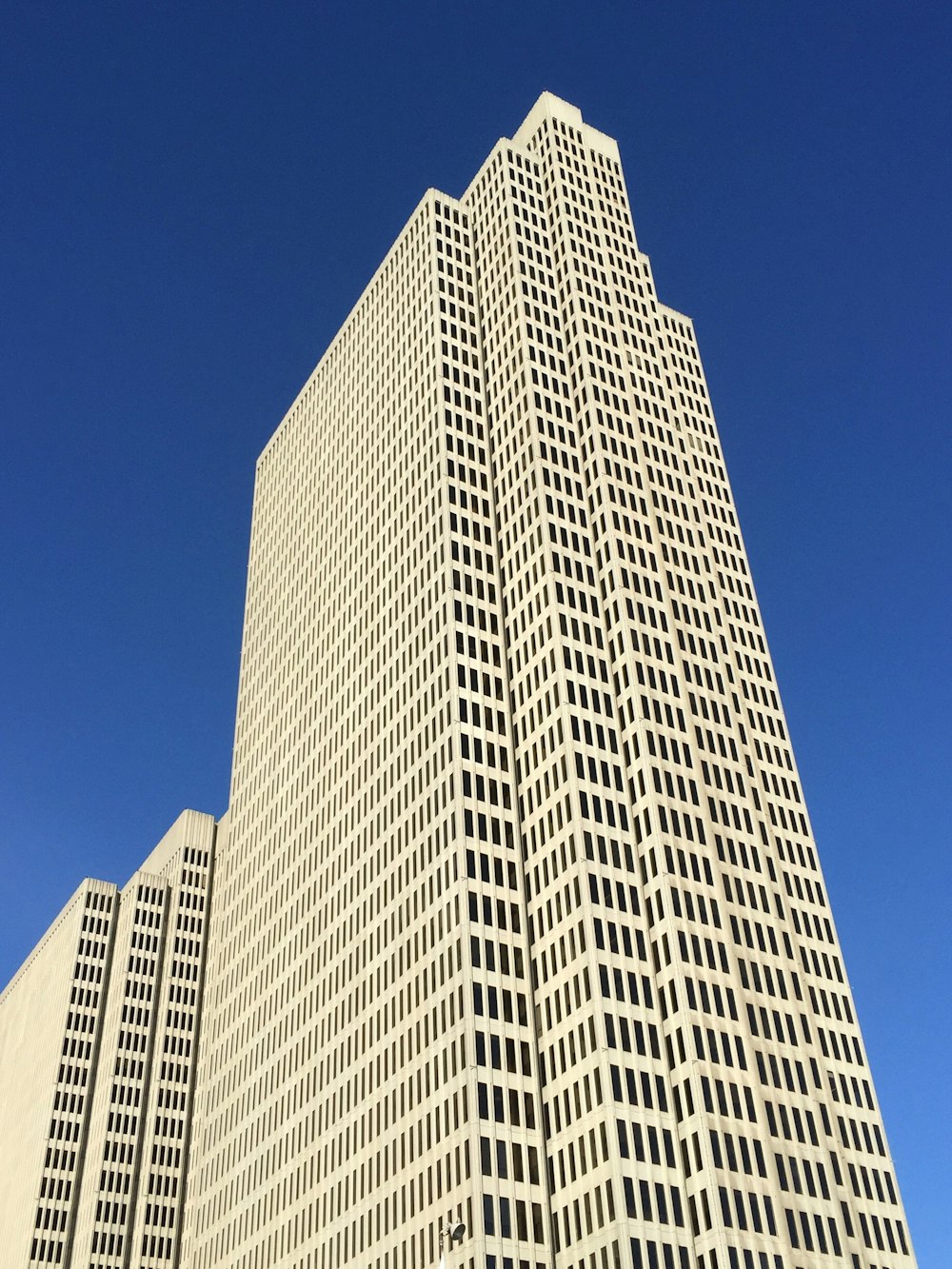 a very tall building with a clock on it's side