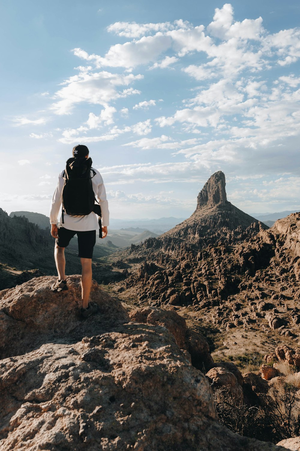 a man standing on top of a rocky mountain