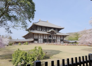 a large building with a lot of trees in front of it