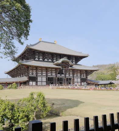 a large building with a lot of trees in front of it