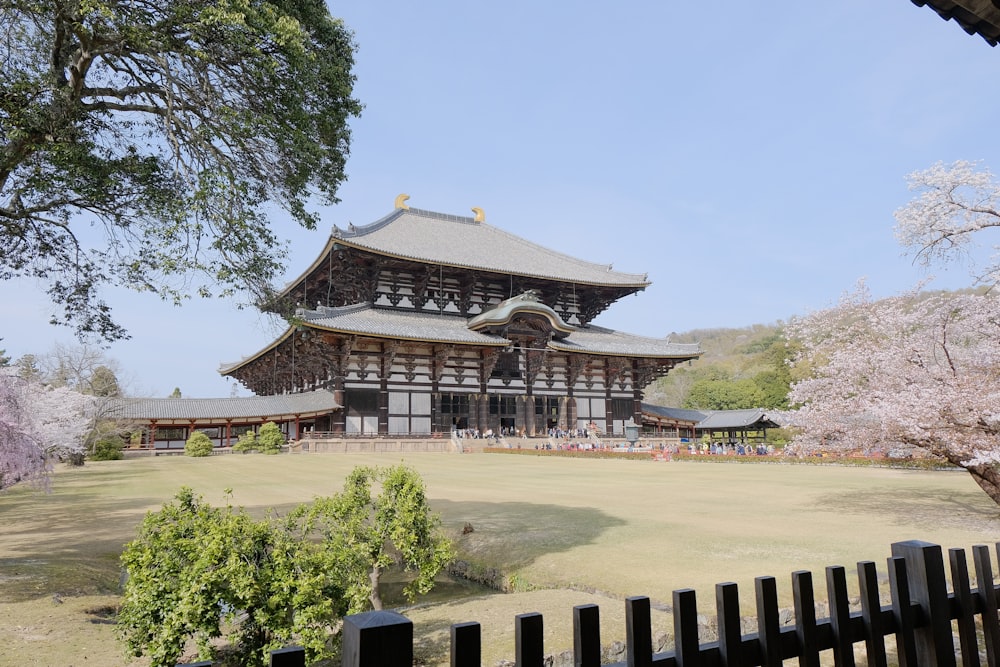 a large building with a lot of trees in front of it