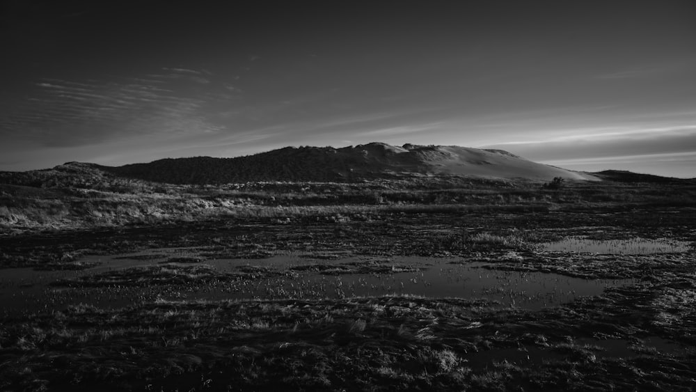 a black and white photo of a mountain range