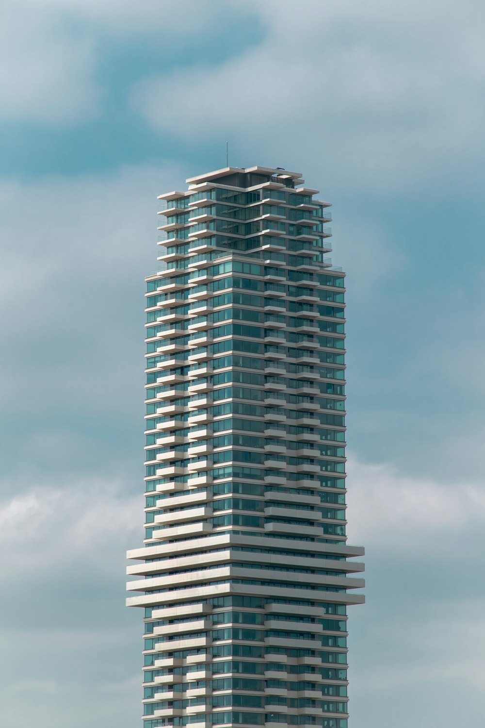 a tall building with a sky background