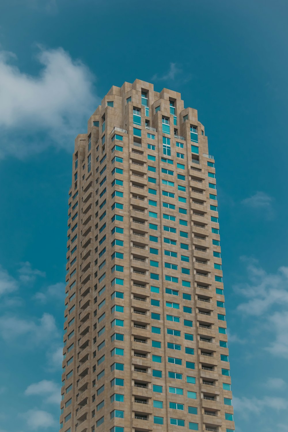 a tall building with many windows on the top of it
