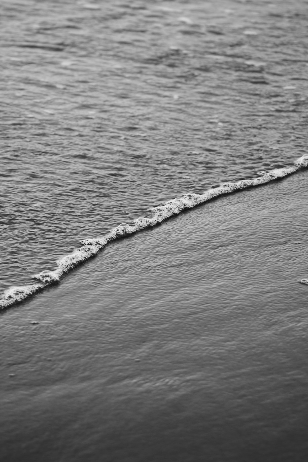 a person riding a surfboard on top of a wave