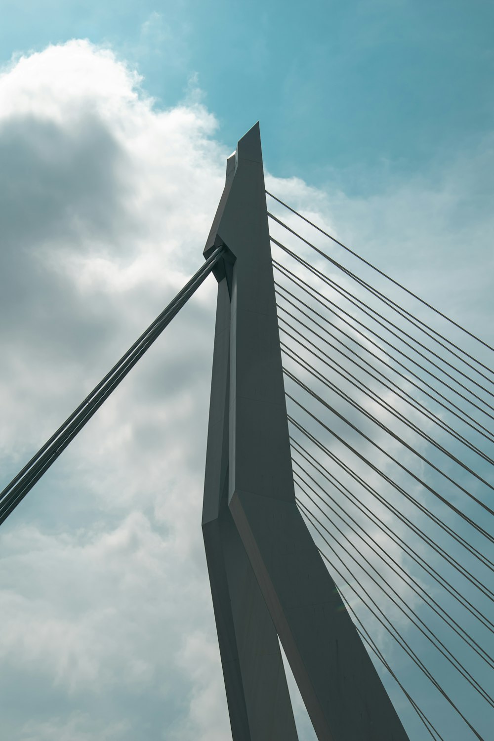 a very tall bridge with a sky background