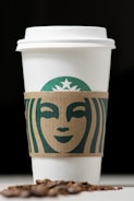 Close-up of a coffee cup with a freshly designed logo on it.