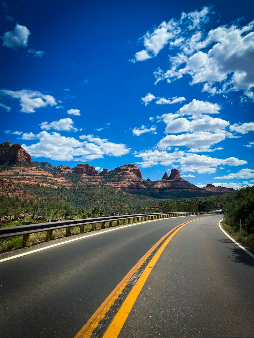 a road with a mountain in the background