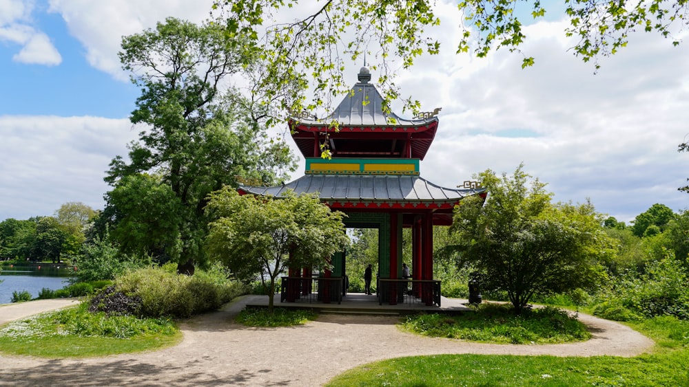 a small pagoda in the middle of a park