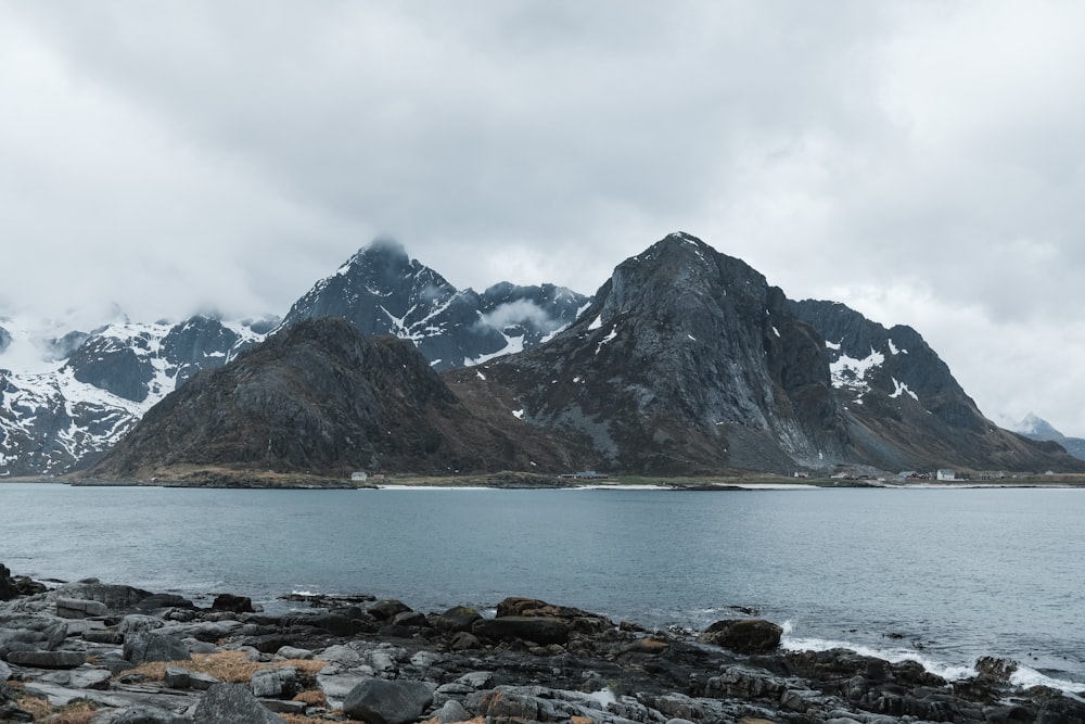 a mountain range with a body of water in front of it