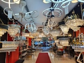 Showroom display featuring various elegant lighting fixtures and chandeliers.