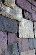 a close up of a wall made of rocks
