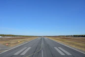 A virtual runway stretching out under clear blue skies in Aviara.