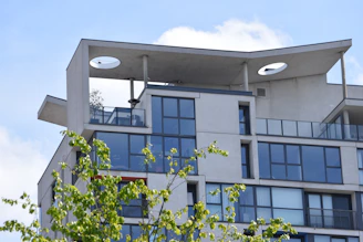 a tall building with two lights on top of it
