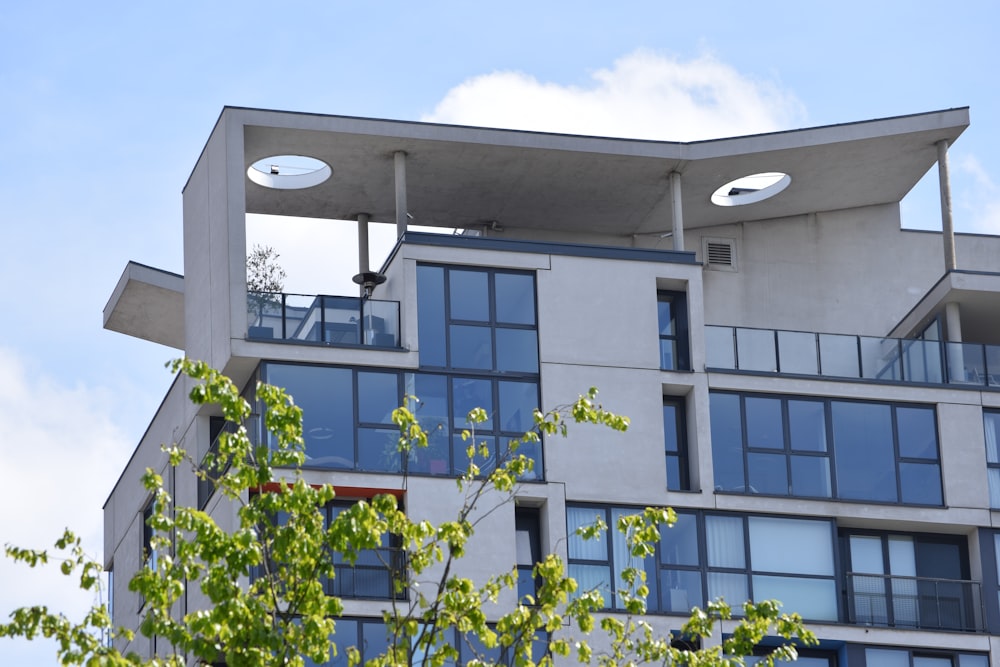 a tall building with two lights on top of it