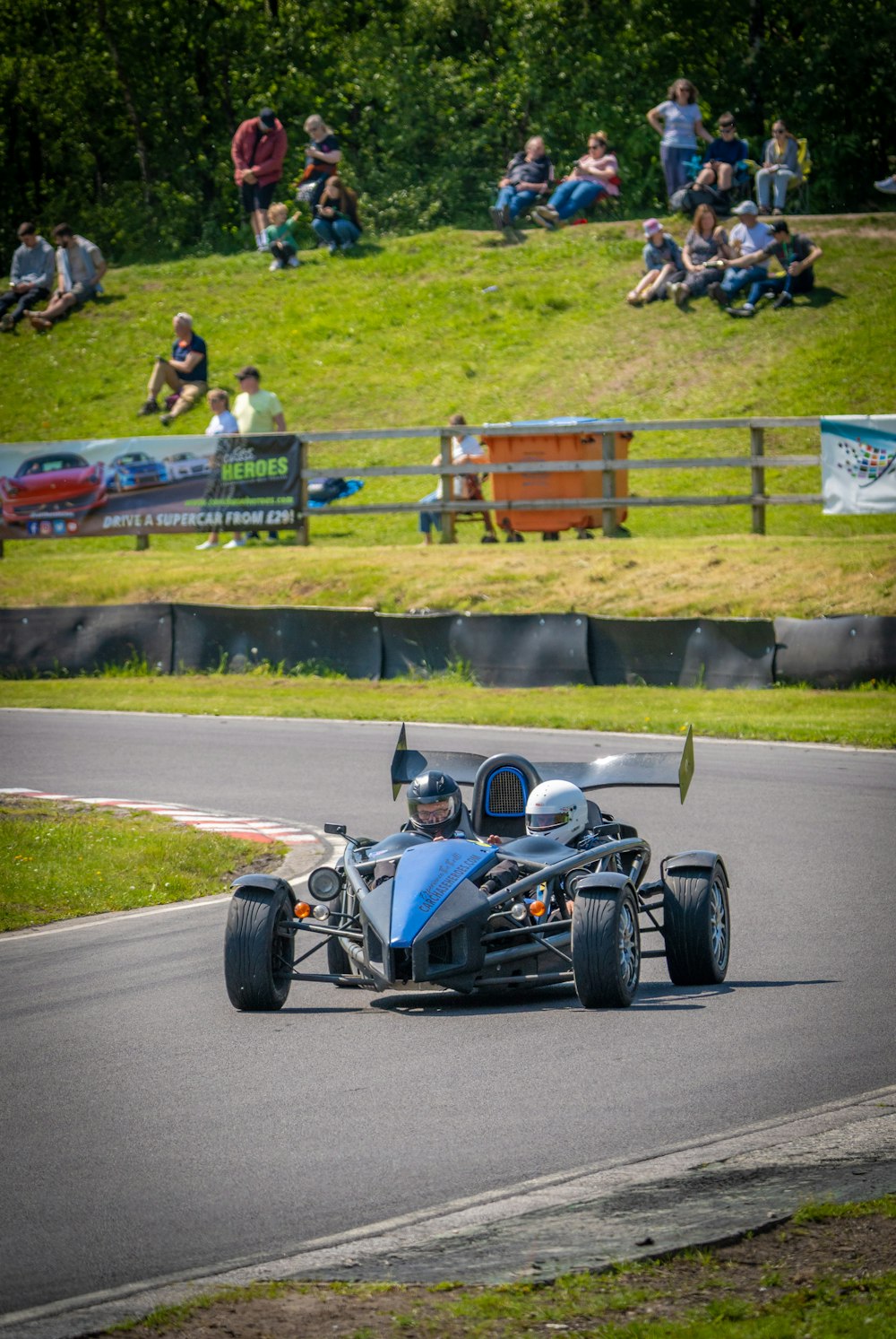 a person driving a race car on a race track