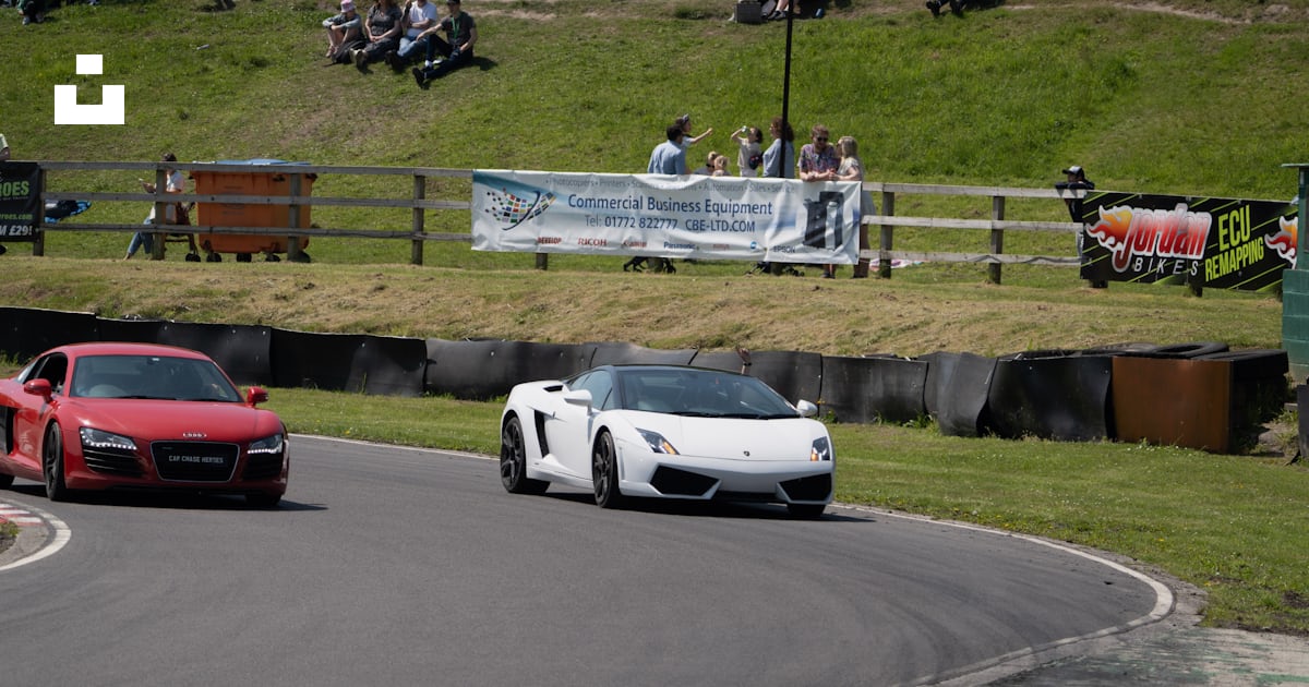Two sports cars driving on a race track photo – Free Three sisters race ...