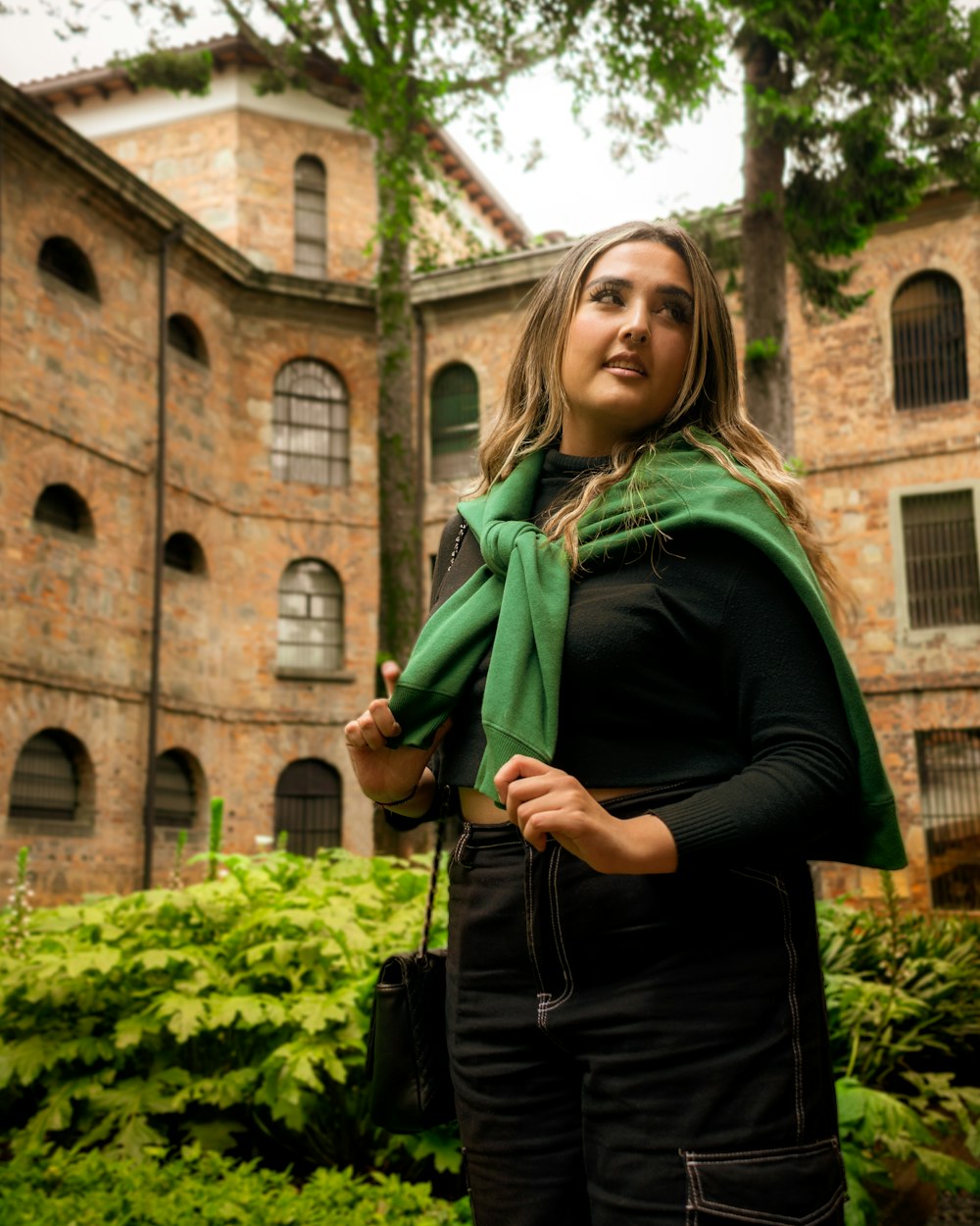 a woman standing in front of a building