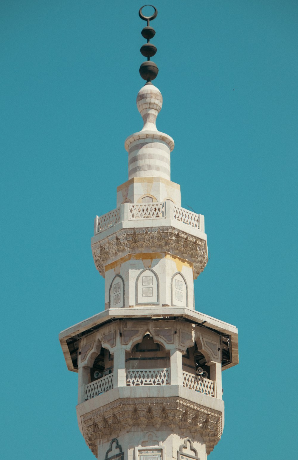 a tall tower with a clock on the top of it