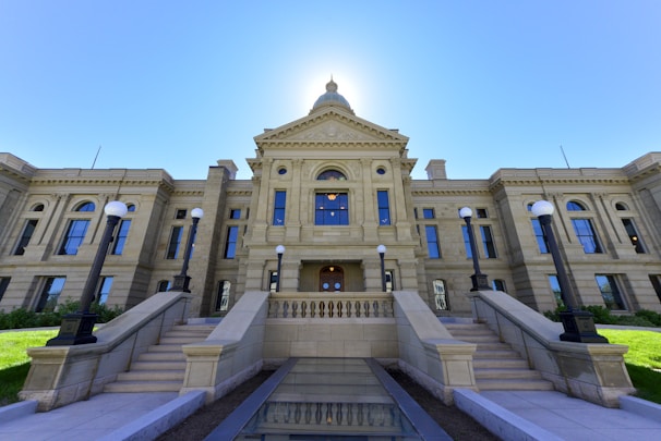 a large building with a fountain in front of it
