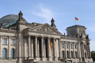a large building with a flag on top of it