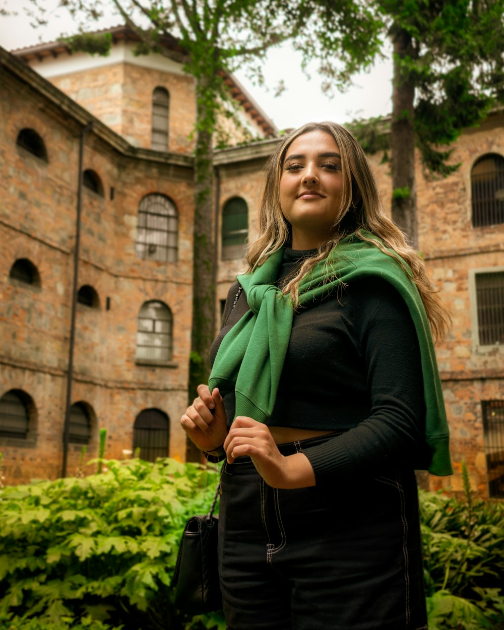 a woman standing in front of a building