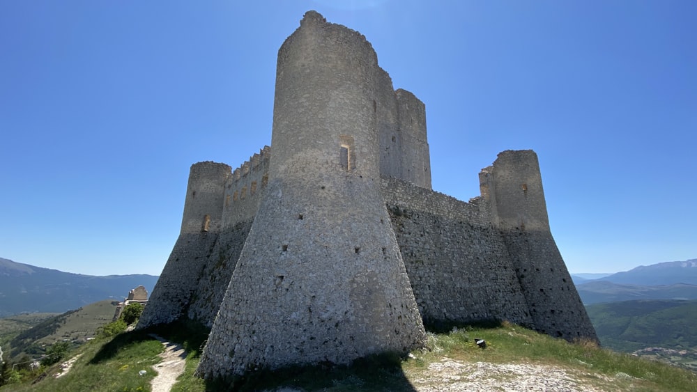 a very tall castle sitting on top of a hill