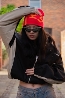 a woman wearing a red hat and sunglasses