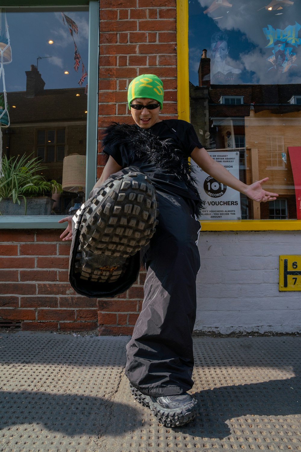 a person standing on a skateboard in front of a store