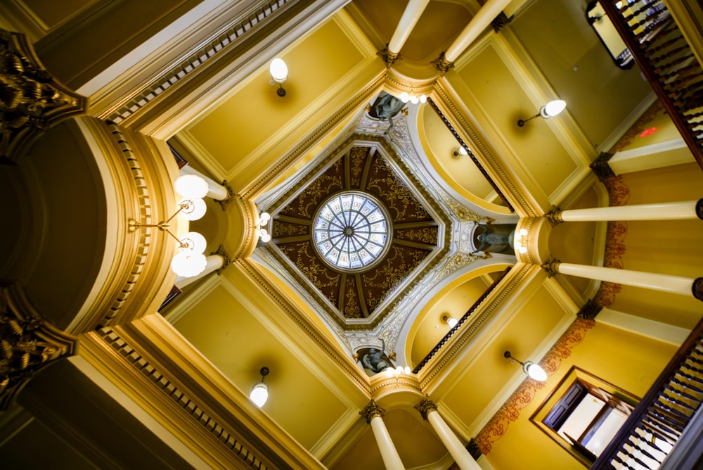 the ceiling of a building with a circular window