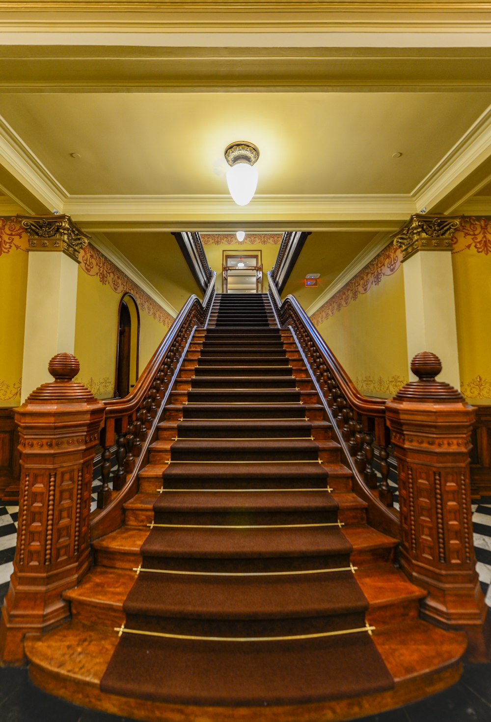 a very long wooden stair case in a building