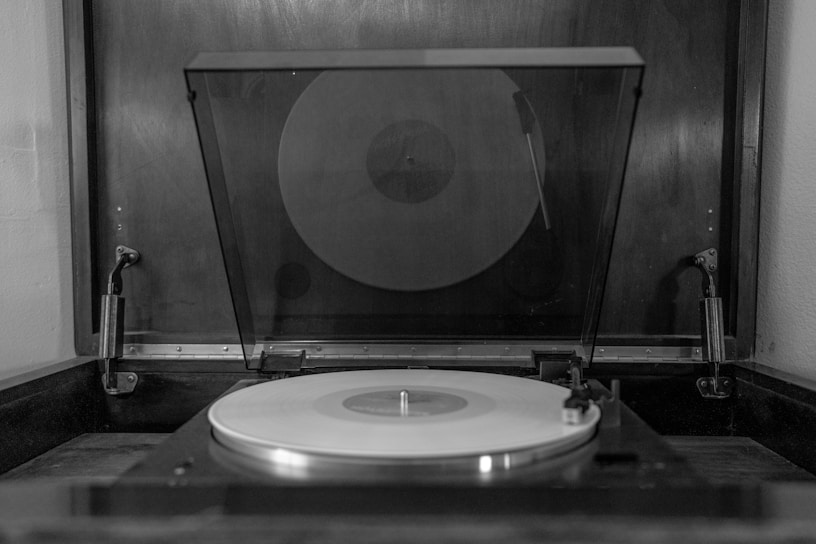 A vintage vinyl record spinning on a turntable.