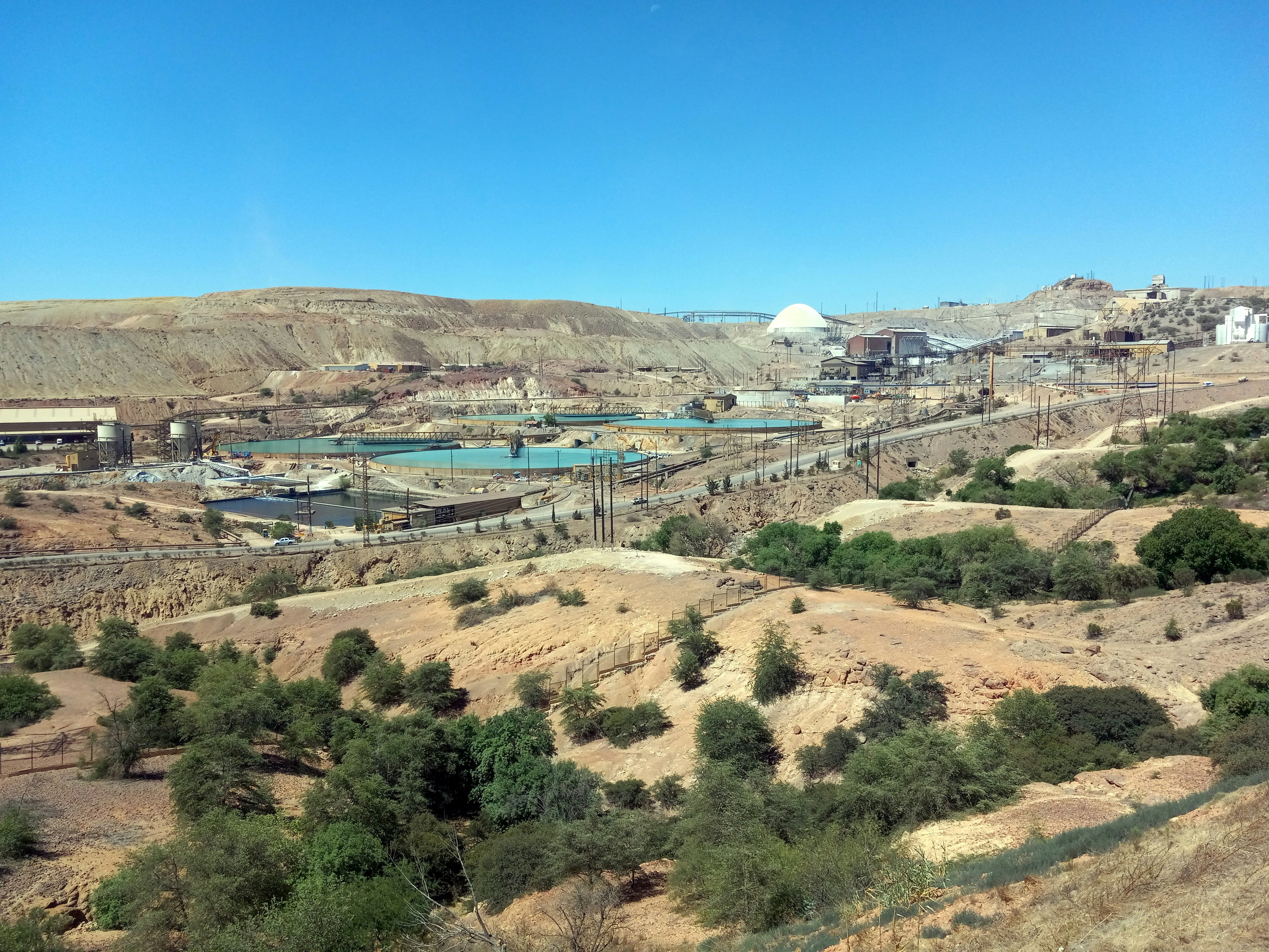 Mining complex water infrastructure in Gauteng South Africa, wide industrial site, daylight