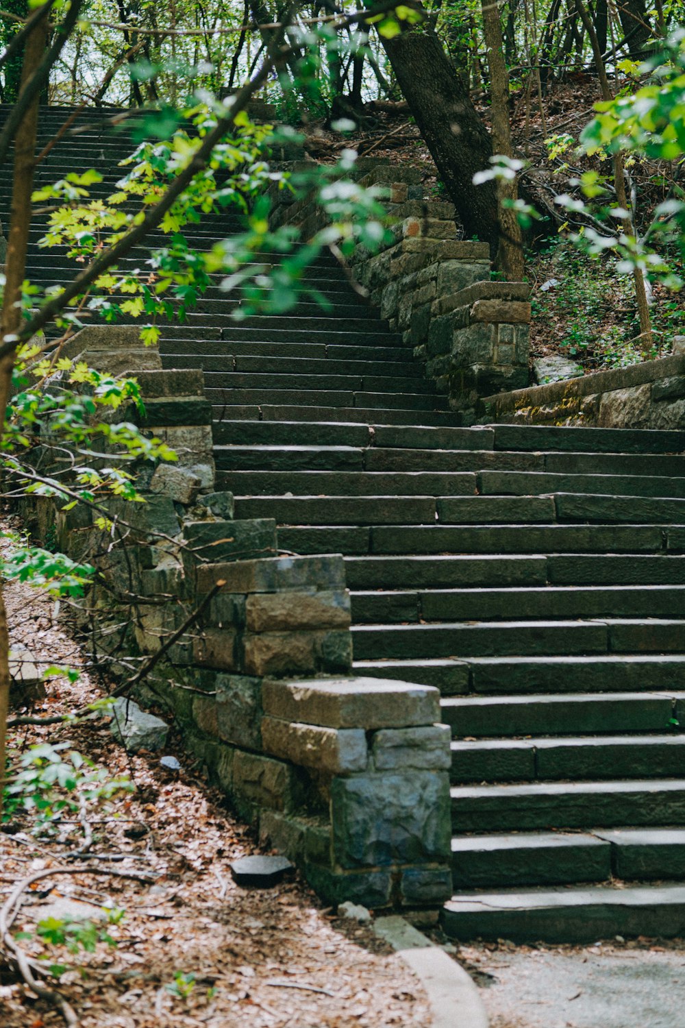 a set of stone steps leading up to the top of a hill