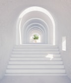 A serene hallway with calming neutral tones and subtle greenery.