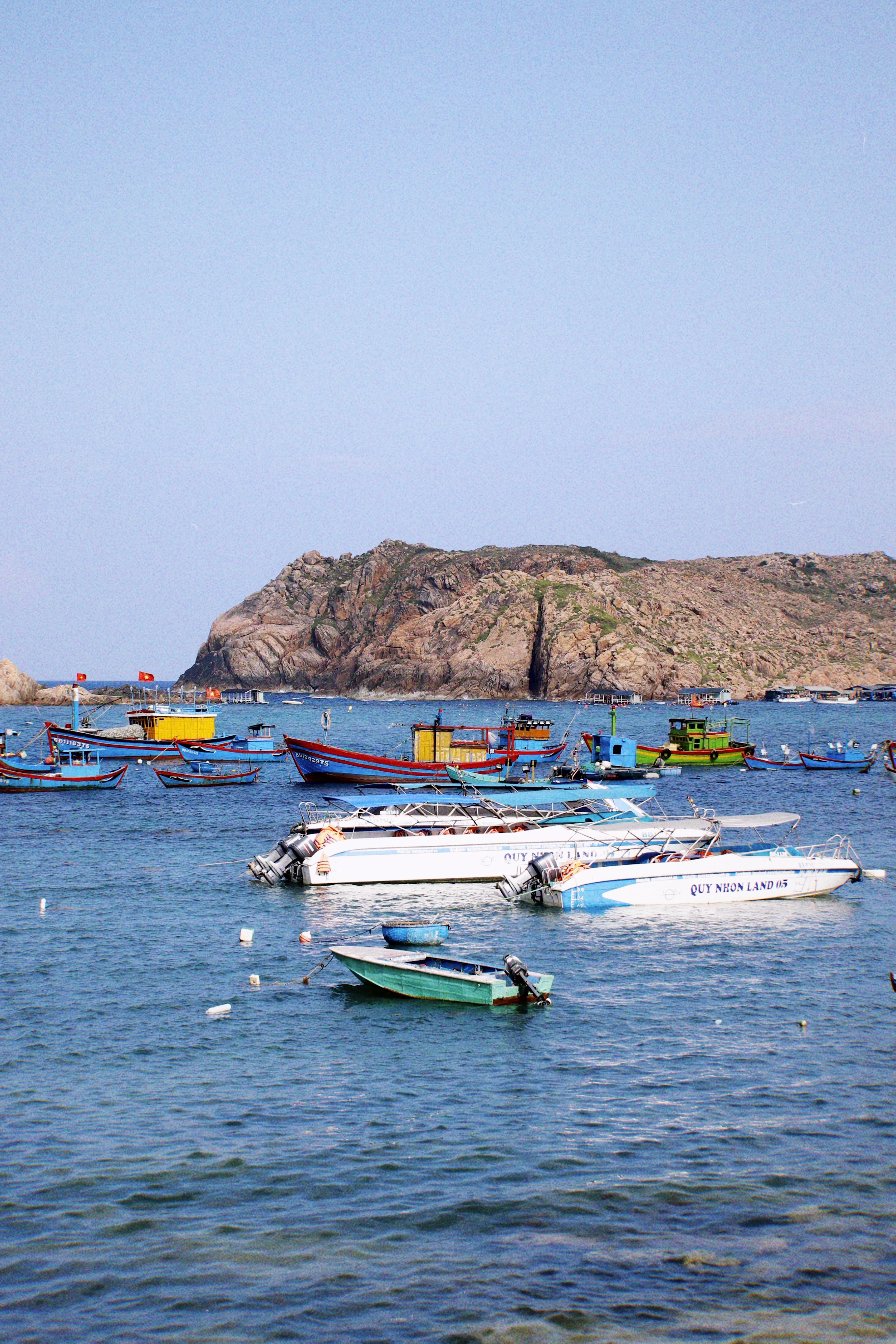 Fishing and day boats in the bay off Nhon Hai island, Quy Nhon