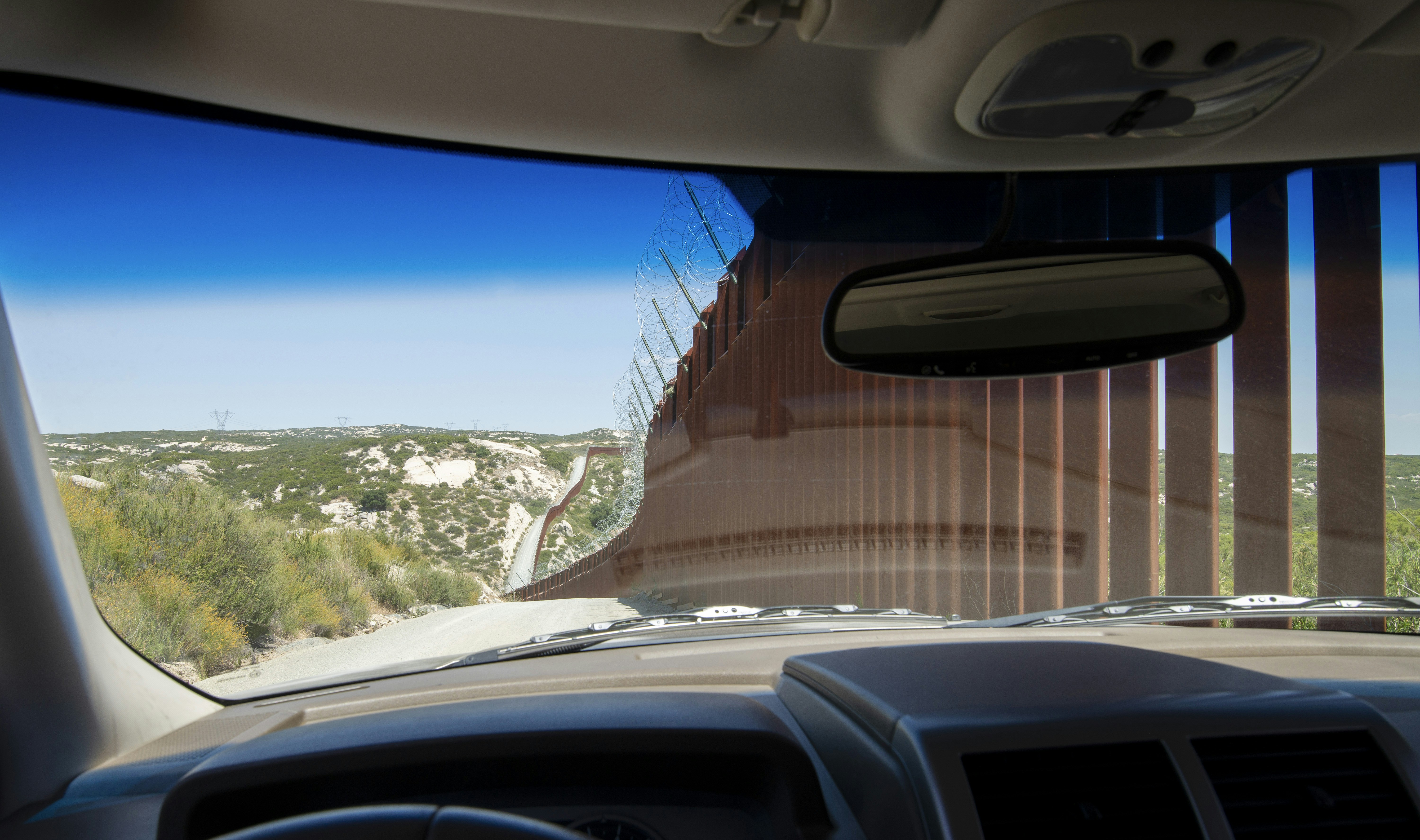 Driving along the American side of the Mexican-American border.