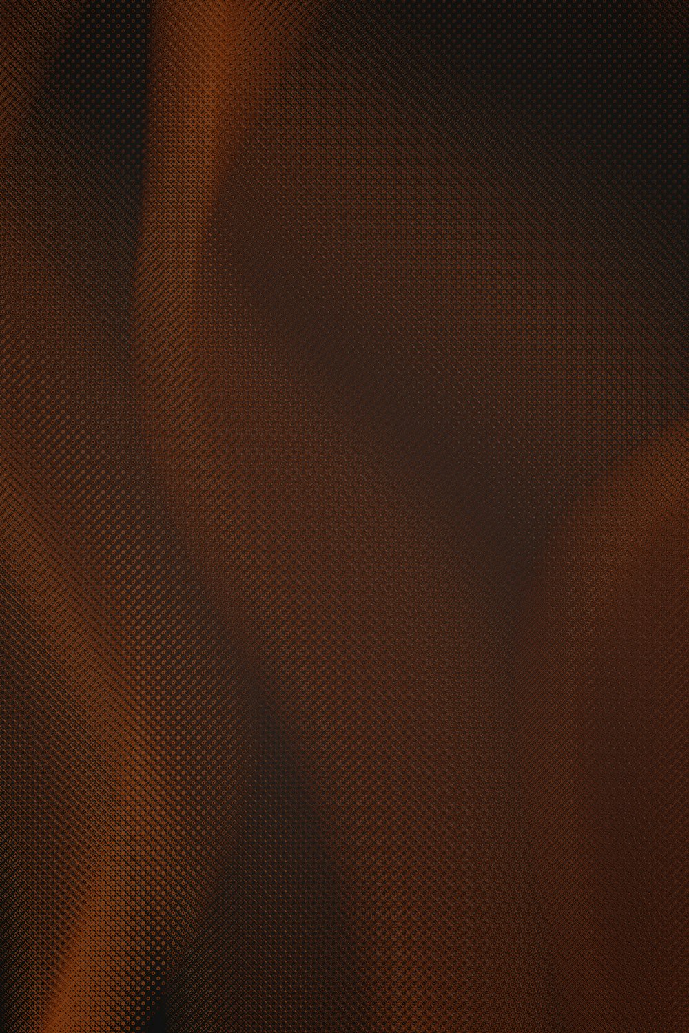 a blurry image of an orange and black background