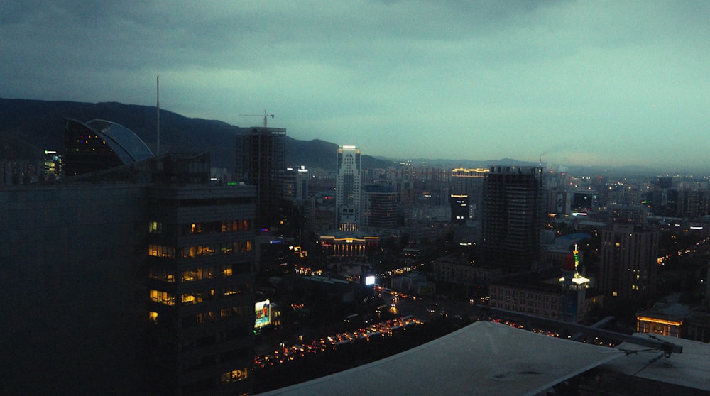 a view of a city at night from the top of a building